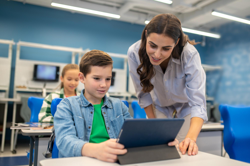 woman-looking-into-tablet-student-boy.jpg